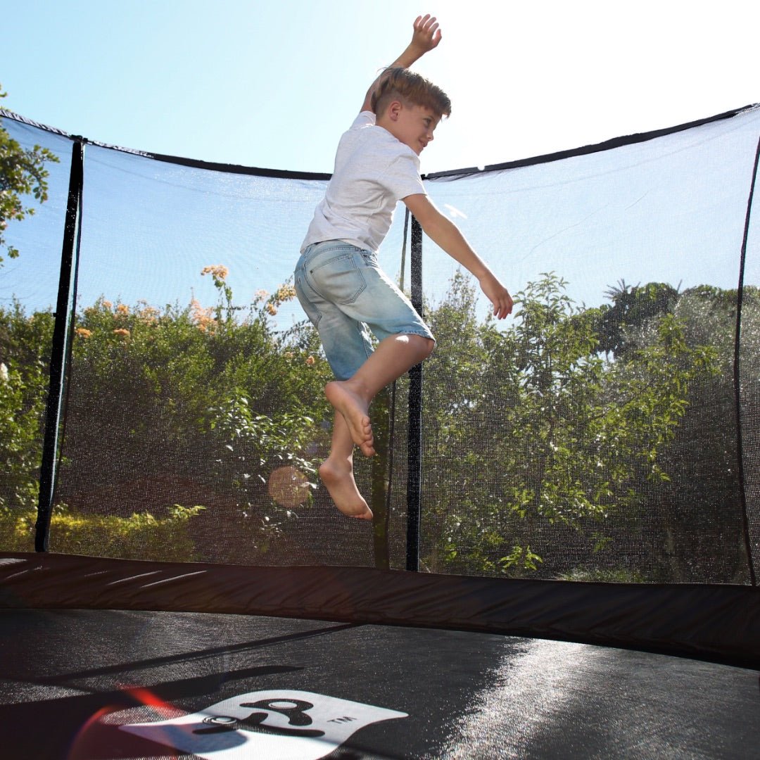  child bouncing on a trampoline 