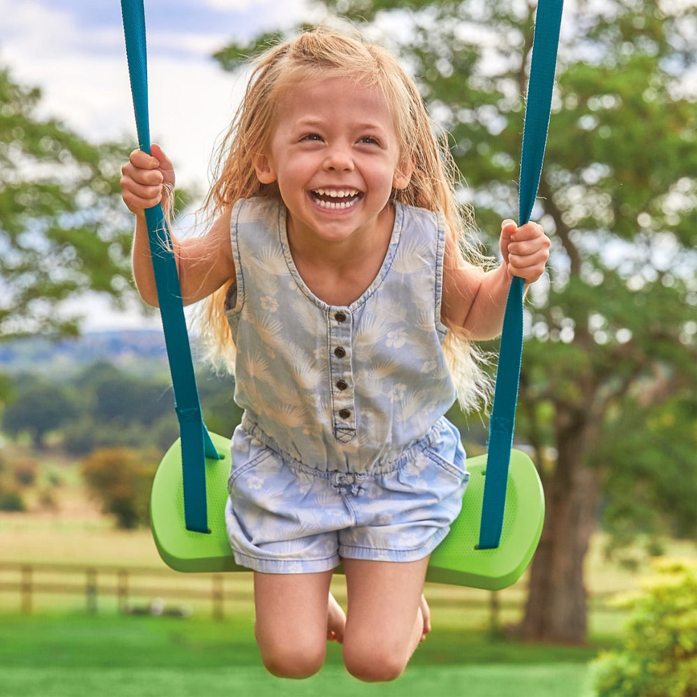 child swinging on a TP rapide swing seat