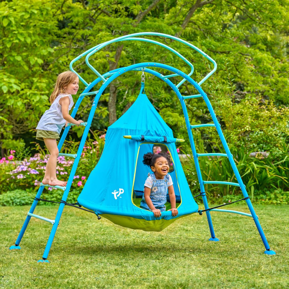 Children playing on blue UFO climbing frame
