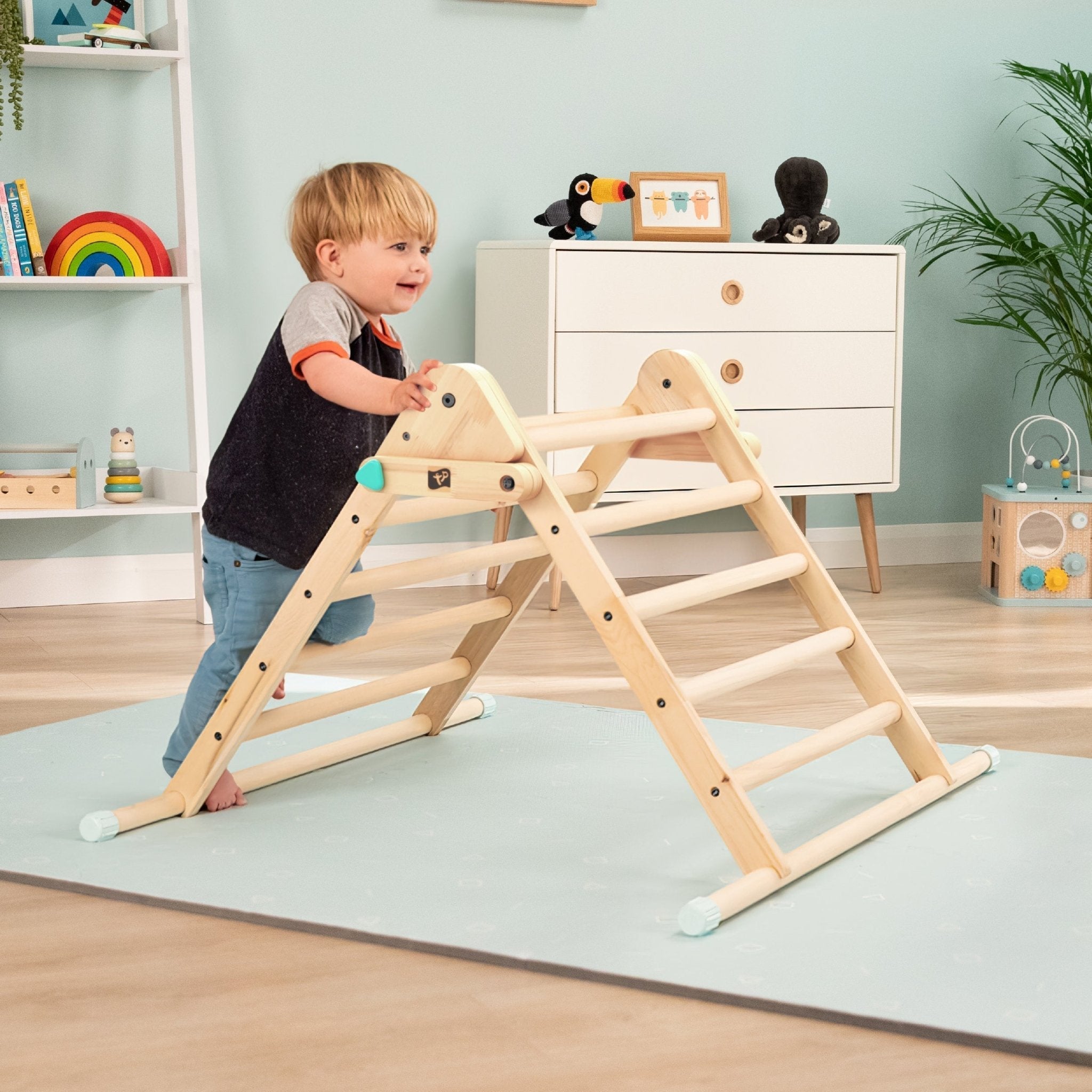  Child playing on climbing triangle 