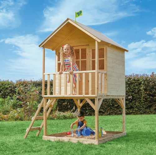 Kids playing in a wooden playhouse