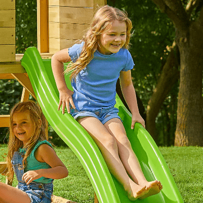 Child sliding down wavy slide