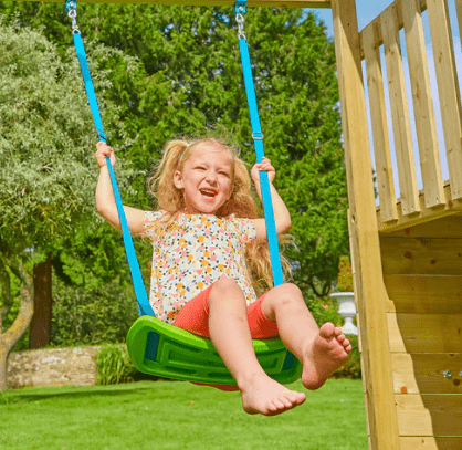 Child swinging on TP Rapide swing seat