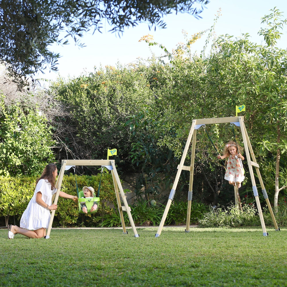 Children swinging on wooden swing sets