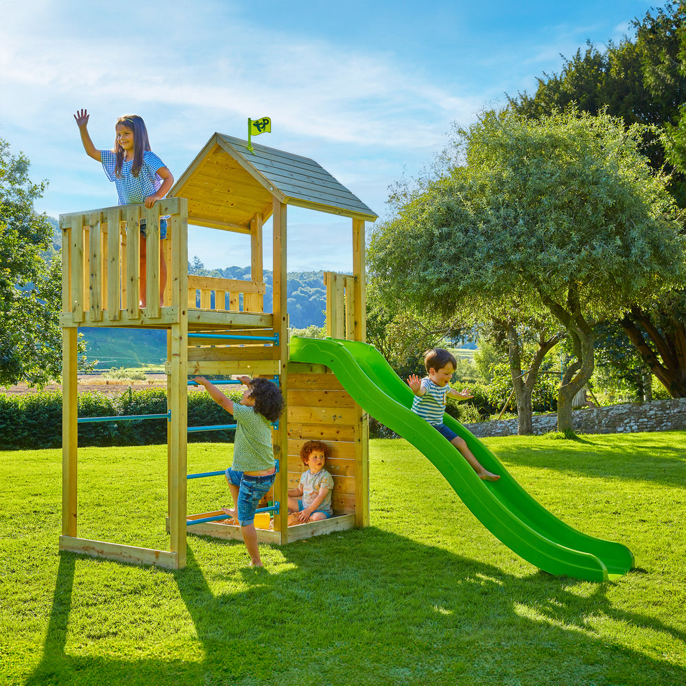 Children playing on a wooden garden climbing frame with slide