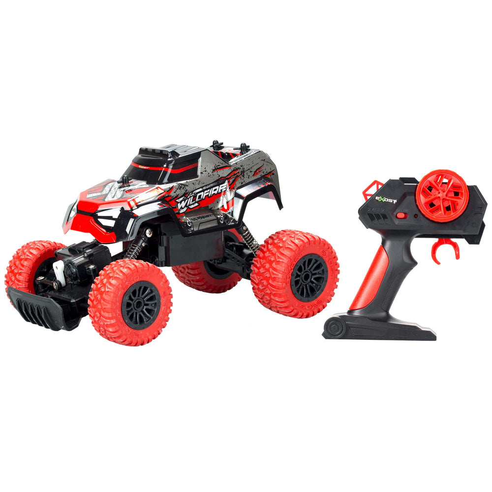 The TP Toys Exost X-Wildfire is a remote control off-road toy truck with large red wheels, shock-absorbing suspension, and a matching black and red controller—ideal for all-terrain crawler adventures.