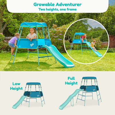 Two children play on the TP Toys TP Growable Adventurer Metal Climbing Frame with slide, shown at both low and full heights, in a grassy garden.
