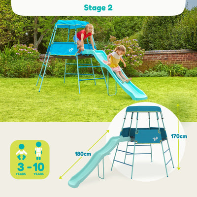 Two children play on the TP Growable Adventurer Metal Climbing Frame by TP Toys in a garden. The blue playset, with slide, is 170cm tall, 180cm long, and suitable for ages 3–10 years.