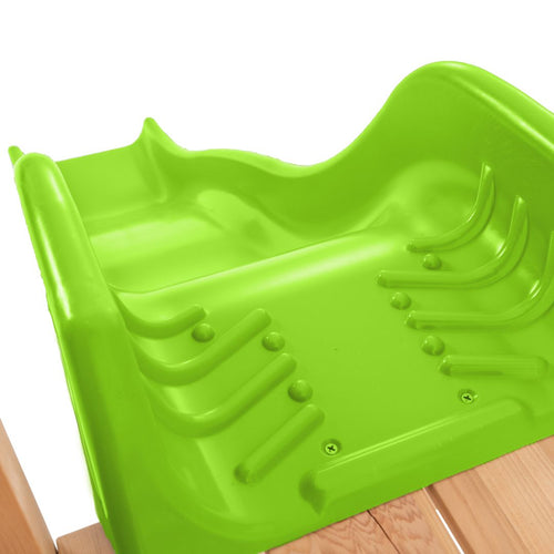 Close-up of the bright green seat on the TP Toys Buttercup Cottage Wooden Playhouse with Deck, Double Swing Arm & 6ft Wavy Slide (FSC® certified), perfect for children's outdoor play.