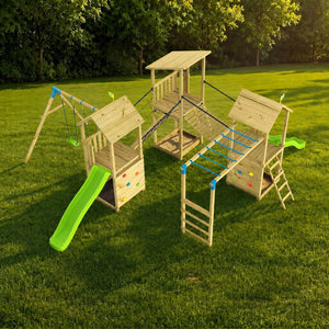 The TP Toys Skywood Three Tower Climbing Frame Play Set, FSC® certified, features three connected towers, two green slides, rock walls, monkey bars, ladders, and swings—set on a grassy lawn with trees behind.