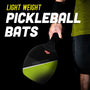 A person holds a black and green TP Toys Pickleball All Surface Swingball bat with the words "Light Weight Pickleball Bats" visible on a dark background.