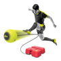A soccer player uses the TP Toys Swingball Reflex Soccer, kicking a yellow ball attached by a cord to a red All Surface base, to demonstrate this solo football training device.