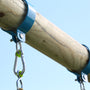 Close-up of a wooden beam with blue metal brackets and hanging chains, part of the TP Knightswood Double Wooden Swing Set With Glide Ride by TP Toys, set against a clear blue sky.
