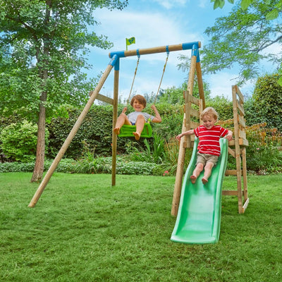 Two children enjoy the TP Toys TP Robin Swing with Roped Rapide Seat and 6ft Slide Set in a grassy backyard; one swings while the other glides down the slide.