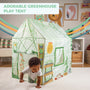 A young child crawls out of the TP Toys Activo Greenhouse Play Tent, an imaginative play set in a colorful, decorated living room.