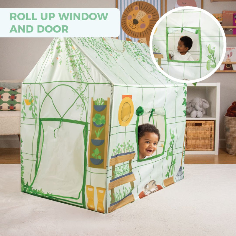 A child peeks from the TP Toys Activo Greenhouse Play Tent, featuring a roll-up window and door—perfect for imaginative play and creative adventures in the playroom.