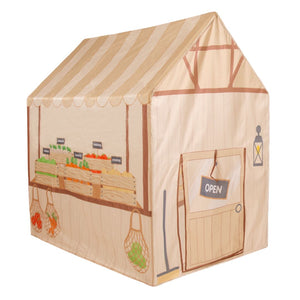 The TP Toys Activo Farmers Market Play Tent looks like a market stall with illustrated veggie crates, an “Open” sign door, and net bags on the side—great for imaginative indoor or outdoor play.