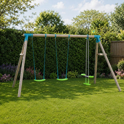 The TP Toys TP Sherwood Triple Wooden Swing Set with Glide Ride—PEFC certified—features two green swings and a glider swing, standing on a grassy lawn amidst trees and bushes under a partly cloudy sky, making it an ideal garden swing set for outdoor fun.