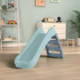 The TP Toys PalPlay Misty Sky Plastic 4ft Folding Slide is shown in a children’s playroom with a wooden floor, toys, plants, and shelves in the background.