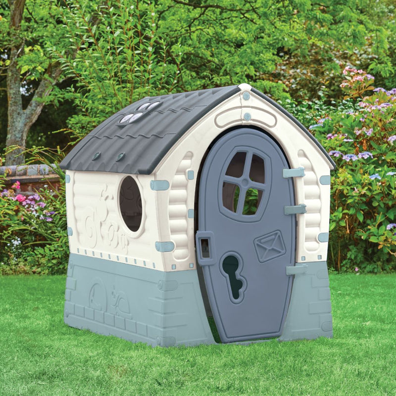 The Palplay Plastic Misty Sky Dream Playhouse by TP Toys features a gray door, sunroof, and UV-resistant roof—ideal for indoor or outdoor play on lawns or patios, blending beautifully with trees, bushes, and flowers.