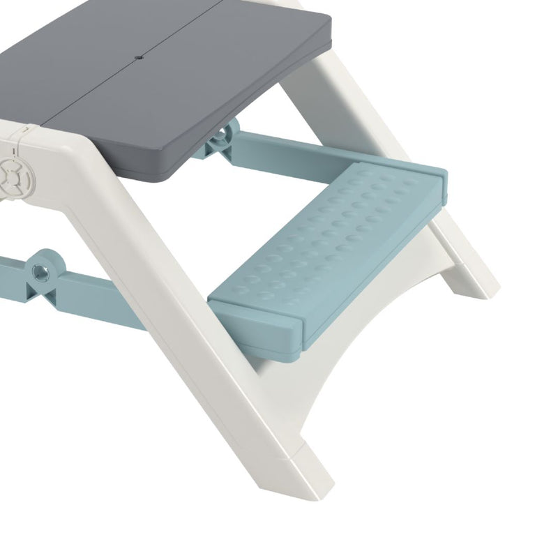 Close-up of the TP Toys Palplay Folding Picnic Bench Misty Sky, featuring a gray seat, white legs, and a textured light blue step—ideal as a children’s bench or for compact indoor/outdoor seating.