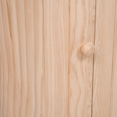 Close-up of the Buttercup Cottage Wooden Playhouse with Floor and Verandah by TP Toys, featuring a light wood cabinet door with a round knob—perfect for outdoor fun and crafted from FSC® certified wood.