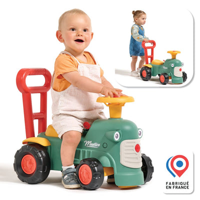 A toddler sits on the Falk Maurice Vintage Baby Green Tractor by TP Toys, featuring a yellow steering wheel. Inset shows a child using the toys push bar as a walking aid. Fabriqué en France logo is visible.