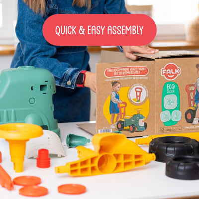 Someone assembles the TP Toys Falk Maurice Vintage Baby Green Tractor from parts on a table, with the box nearby. Text overlay: Quick & Easy Assembly.