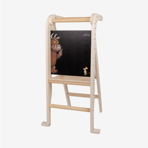 The Gruffalo Wooden Helper Tower – FSC® certified by TP Toys features a built-in chalkboard and charming illustrations of the Gruffalo and mouse facing each other, providing an engaging kids’ kitchen step stool that encourages creativity and imaginative play during daily routines.