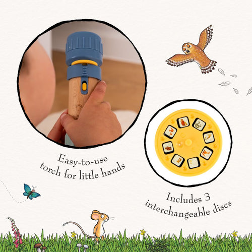 A child holds The Gruffalo Projecter by TP Toys; features a blue and wood design, 3 picture discs, bird and mouse images, and is easy for little hands to use.
