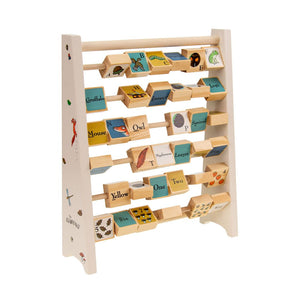The Gruffalo Wooden Mini Abacus - FSC® certified by TP Toys is an educational toy featuring rotating blocks that display images, letters, words, and numbers. Designed as an early learning tool, it helps children learn the alphabet, animals, and counting while supporting the development of fine motor skills.