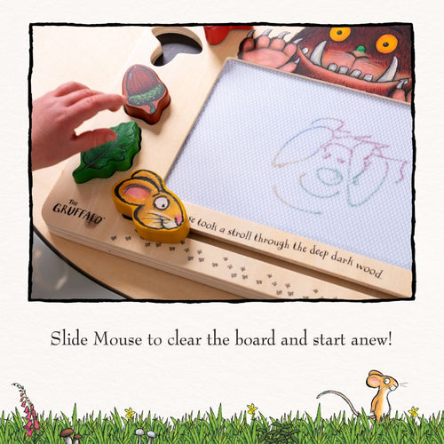 A child draws on The Gruffalo Wooden Magnetic Drawing Board - FSC® certified by TP Toys, with a pen and character pieces beside the partially erased sketch.