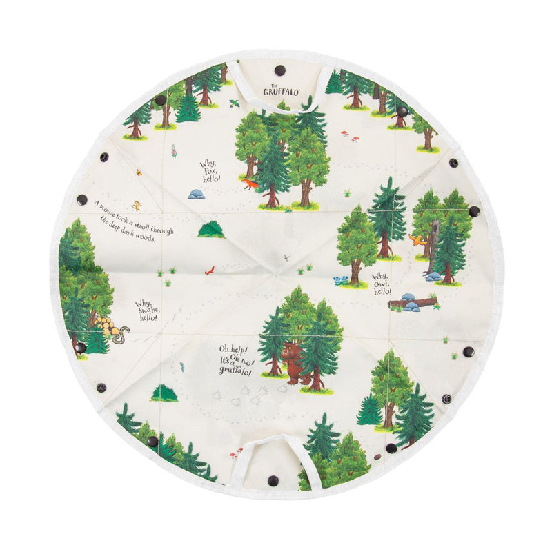 Bring storytime to life with the TP Toys Gruffalo Play Set with Wooden Characters. This round cloth playmat is adorned with charming illustrated forest scenes, woodland animals, and beloved Gruffalo characters. Among the trees and wildlife, you’ll find printed phrases like “Oh help! It’s a Gruffalo!” Easy-to-use black button fasteners let you quickly set up this double-sided fabric mat—perfect for imaginative adventures with your favorite wooden figures from The Gruffalo Play Set by TP Toys.