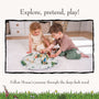 Two children sit on a white rug, playing with the TP Toys Gruffalo Play Set with Wooden Characters on a round illustrated play mat in a bright, tidy room.