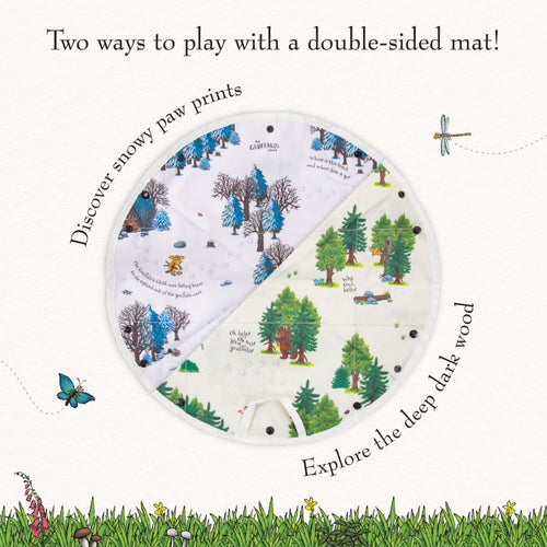This circular, double-sided fabric playmat from TP Toys features snowy paw prints on one side and a green forest scene with illustrated trees, animals, and character quotes on the other—perfect for use with your The Gruffalo Play Set with Wooden Characters.