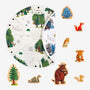 A circular illustrated playmat featuring a forest scene is partially folded open and surrounded by TP Toys’ The Gruffalo Play Set with Wooden Characters, including charming figures such as a fox, owl, mouse, snake, Gruffalo, and trees. This delightful double-sided fabric playmat perfectly complements the set and inspires imaginative woodland adventures.