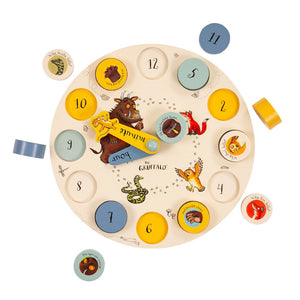 The Gruffalo Wooden Counting Clock by TP Toys is an FSC® certified, round wooden clock featuring removable number pieces and charming animal illustrations on a white background—perfect for encouraging early numeracy skills.