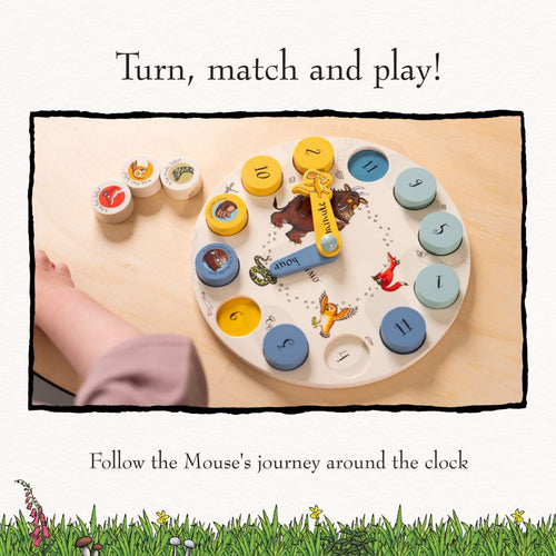 A child’s hand turns the TP Toys The Gruffalo Wooden Counting Clock – FSC® certified, a delightful counting toy featuring numbered and animal-themed pieces with charming illustrations from The Gruffalo, making it a perfect introduction to early numeracy.