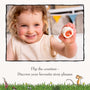 A young child holds up a colorful counter from the TP Toys The Gruffalo Wooden Counting Clock—FSC® certified—and smiles at the camera. This engaging clock encourages early numeracy as children turn the counters to reveal their favorite phrases from The Gruffalo story.