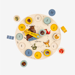 The Gruffalo Wooden Counting Clock - FSC® certified by TP Toys is a delightful wooden clock that features charming illustrations of the owl, fox, mouse, and snake from The Gruffalo. With numbered pieces to support early numeracy and movable blue and red hands for encouraging time recognition skills in young learners, this Gruffalo-themed toy is perfect for educational play.