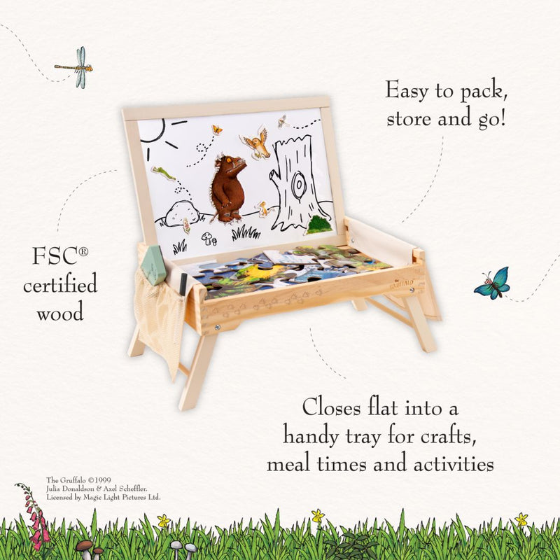 The Gruffalo Wooden Creative Station - FSC® certified from TP Toys is a kids activity easel featuring an illustrated board, side storage pouch, and folding tray. Made from FSC certified wood, this creative wooden toy includes magnetic pieces and a compact design—ideal for crafts, meals, and easy storage.