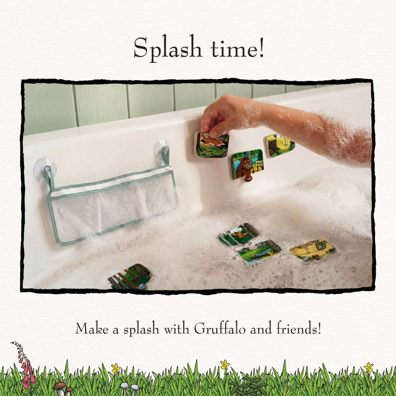 A child’s arm in a bubble-filled bathtub, playing with TP Toys’ The Gruffalo Foam Bath Figures—fun foam bath toys that stick to the tub wall. A mesh pouch for storage is attached to the side of the tub, keeping these imaginative toys tidy and within easy reach.