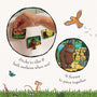 A hand places illustrated foam tiles with animal characters on a bath surface. The TP Toys Gruffalo Foam Bath Figures stick when wet and feature 9 scenes to assemble, making them perfect bath time toys for creative play.