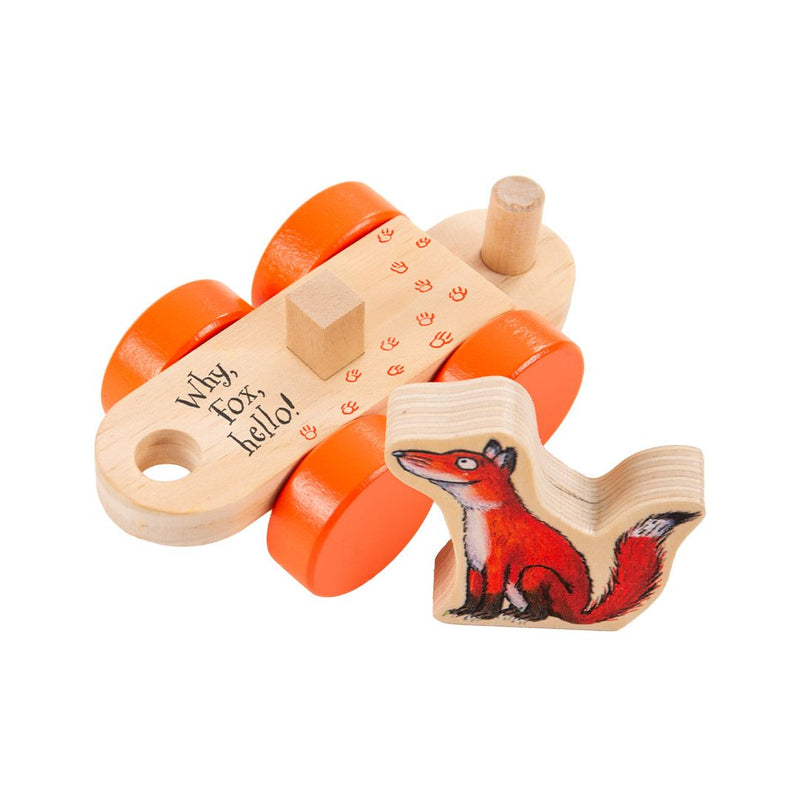 The Gruffalo Wooden Pull Along Character Set by TP Toys features a wooden toy with four orange wheels and the text “Why, Fox, Hello!” beside a painted wooden fox figure. Both pieces have a natural wood finish and are displayed on a white background, making them perfect for imaginative play. FSC® certified, this delightful set is an ideal addition to any collection of Gruffalo wooden pull along toys.