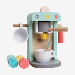 Introducing the Owl & Fox Wooden Coffee Machine by TP Toys—a pastel-colored playset made from FSC® certified wood. This set includes a charming wooden coffee machine, two cups, a spoon, and several colorful pretend coffee pods—perfect for pretend play and Montessori toy collections.
