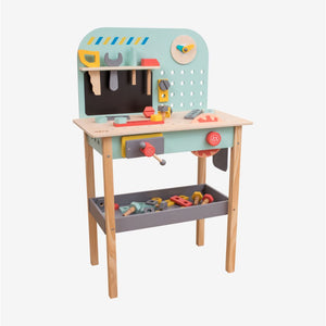 The Owl & Fox Wooden Workbench Set by TP Toys is an FSC® certified children’s workbench that includes a full tool set—hammer, wrench, screwdriver, and a variety of colorful pieces—neatly organized on and below the table, making it perfect for imaginative pretend play.