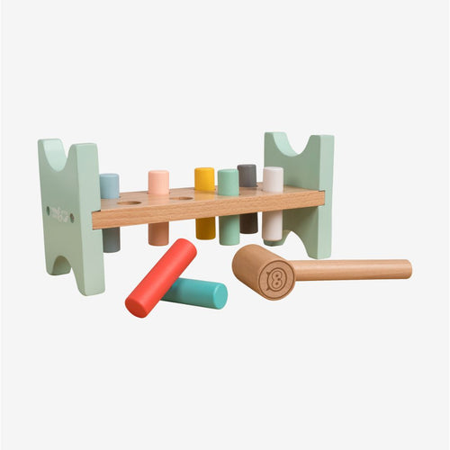 The TP Toys Owl & Fox Wooden Hammer Bench - FSC® certified features pastel-colored pegs, a wooden mallet, and a mint green and natural wood frame—ideal for pretend play and developing fine motor skills.