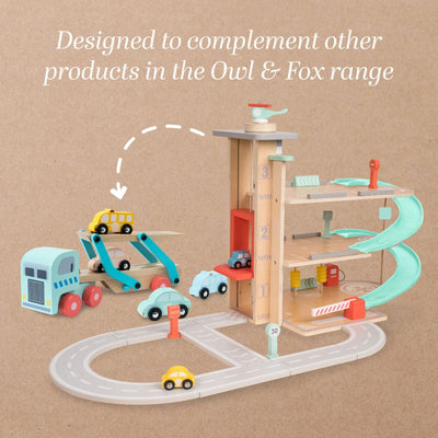 Wooden toy car garage playset with levels, cars, ramps, and road pieces; compatible with TP Toys Owl & Fox Wooden Vehicle Transporter (FSC® certified) and other wooden toy truck sets. Product compatibility highlighted in text above.