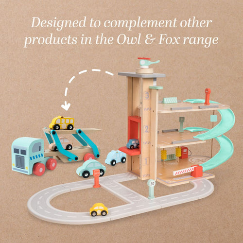 Wooden toy car garage playset with levels, cars, ramps, and road pieces; compatible with TP Toys Owl & Fox Wooden Vehicle Transporter (FSC® certified) and other wooden toy truck sets. Product compatibility highlighted in text above.