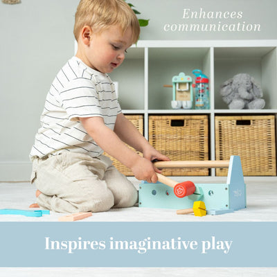 A young child sits on the floor playing with a TP Toys Owl & Fox Wooden Tool Caddy - FSC® certified, with shelves and baskets in the background. Text reads: Enhances communication and inspires imaginative play.